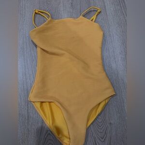 Of one sea yellow reversible one piece